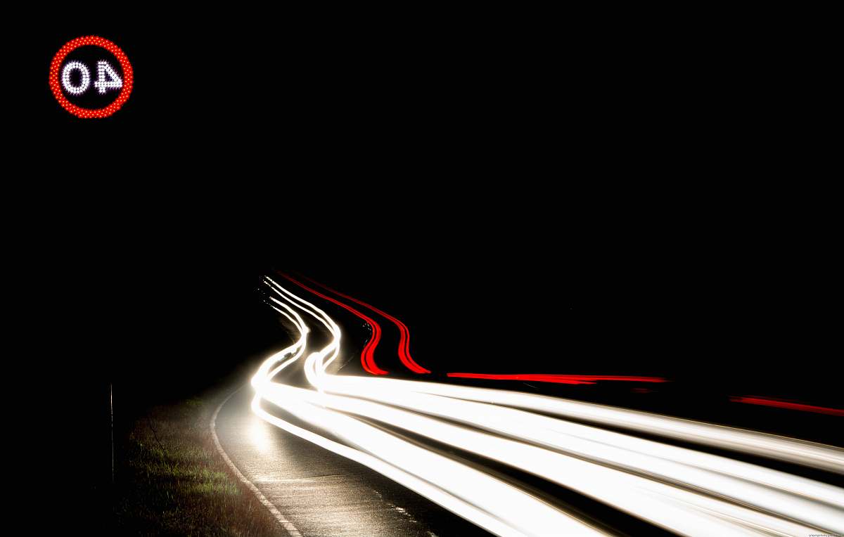 night time long-exposure photography of light streaks on road during nighttime car light